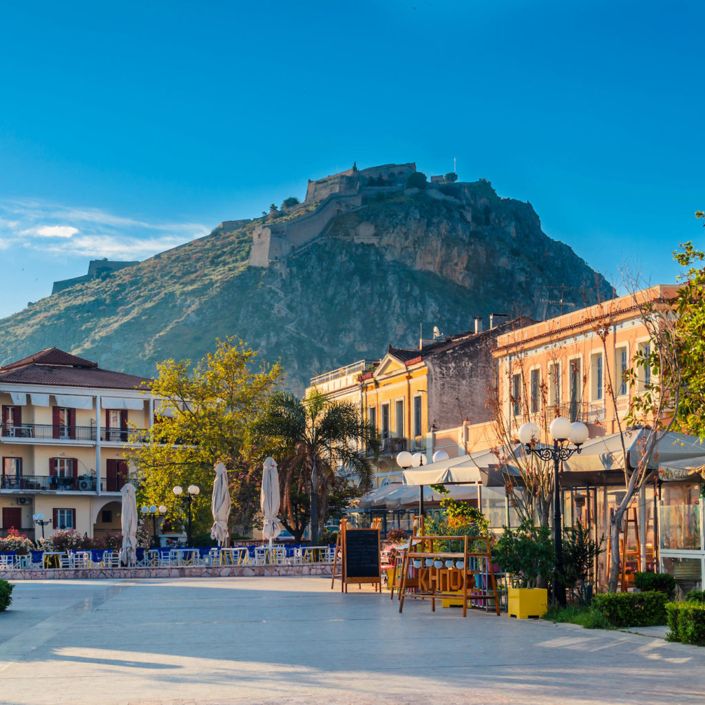 Nafplio Greece- Philellinon square-The historic square of the city located in the old town.The castle of Palamidi in the background.