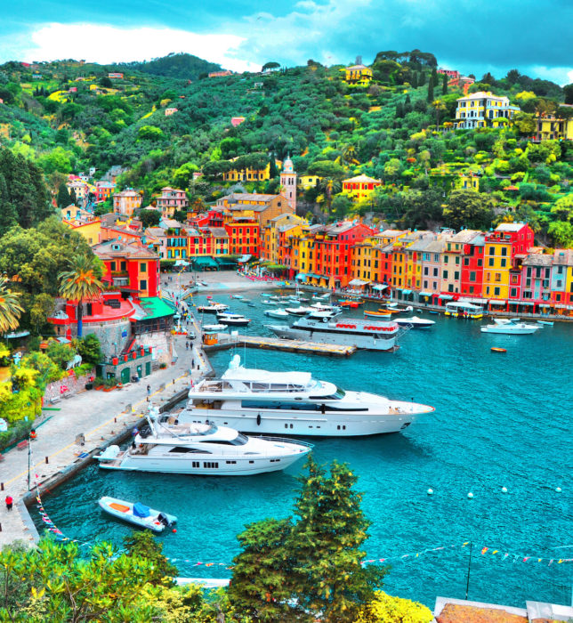 PORTOFINO , ITALY - MAY 02, 2016: The beautiful Portofino with colorful houses and villas, luxury yachts and boats in little bay harbor. Liguria, Italy, Europe