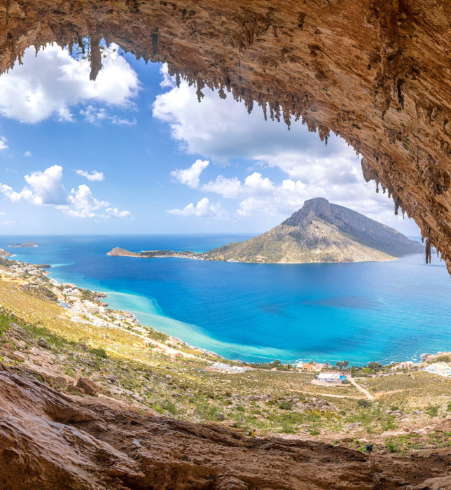 KALYMNOS ISLAND, GREECE - May 7, 2019.The famous Grande Grotta , one of the most popular climbing fields of Kalymnos island, Greece. In the background, Telendos island.